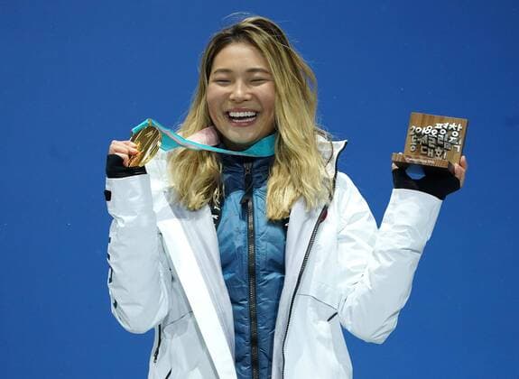 Gold medalist American Chloe Kim celebrates during the medal ceremony for Ladies Snowboard Halfpipe at the medal s plaza during the Pyeongchang 2018 Winter Olympics in Pyeongchang, South Korea, on February 13, 2018.  OLY20180213395 KEVINxDIETSCH