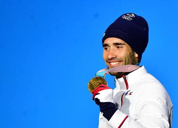 Gold medalist France s Martin Fourcade celebrates during the medal ceremony for Biathlon Men s 12.5km Pursuit at the medal s plaza during the Pyeongchang 2018 Winter Olympics in Pyeongchang, South Korea, on February 13, 2018.  OLY20180213364 KEVINxDIETSCH