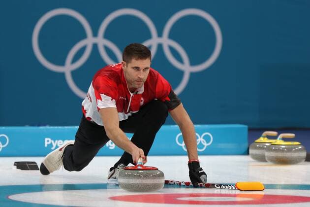 John Morris of Canada delivers a stone during the Gold Medal Mixed Doubles game against Switzerland at the Gangneung Curling Center in Gangneung, South Korea during the 2018 Pyeongchang Winter Olympics on February 13, 2018. Canada won 10-3.  OLY20180213814 ANDREWxWONG