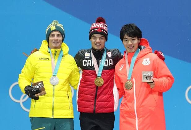 (180213) -- PYEONGCHANG, Feb. 13, 2018 -- Champion Mikael Kingsbury from Canada (C), second-placed Matt Graham from Australia (L) and third-placed Daichi Hara from Japan pose for photos during the medal ceremony of men s moguls event of freestyle skiing at 2018 PyeongChang Winter Olympic Games Olympische Spiele Olympia OS at the Medal Plaza in PyeongChang, South Korea, on Feb. 13, 2018. ) (SP)OLY-SOUTH KOREA-PYEONGCHANG-FREESYTLE SKIING-MEN S MOGULS-MEDAL CEREMONY BaixXuefei 