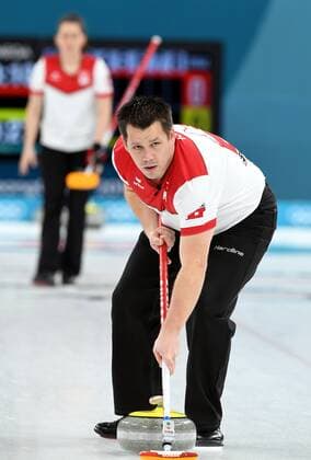(180213) -- PYEONGCHANG, Feb. 13, 2018 -- Martin Rios of Switzerland competes during mixed doubles gold medal game of curling between Canada and Switzerland at the Pyeongchang 2018 Winter Olympic Games Olympische Spiele Olympia OS at Gangneung Curling Centre?Gangneung, South Korea, Feb. 13, 2018. Switzerland lost 3:10. ) (SP)OLY-SOUTH KOREA-PYEONGCHANG-CURLING-MIXED DOULBES-GOLD MEDAL GAME MaxPing 