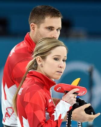 (180213) -- PYEONGCHANG, Feb. 13, 2018 -- Kaitlyn Lawes (front) and John Morris of Canada react during the mixed doubles gold medal game of curling between Canada and Switzerland at the Pyeongchang 2018 Winter Olympic Games Olympische Spiele Olympia OS at Gangneung Curling Centre?Gangneung, South Korea, Feb. 13, 2018. Canada won 10:3. ) (SP)OLY-SOUTH KOREA-PYEONGCHANG-CURLING-MIXED DOULBES-GOLD MEDAL GAME MaxPing 