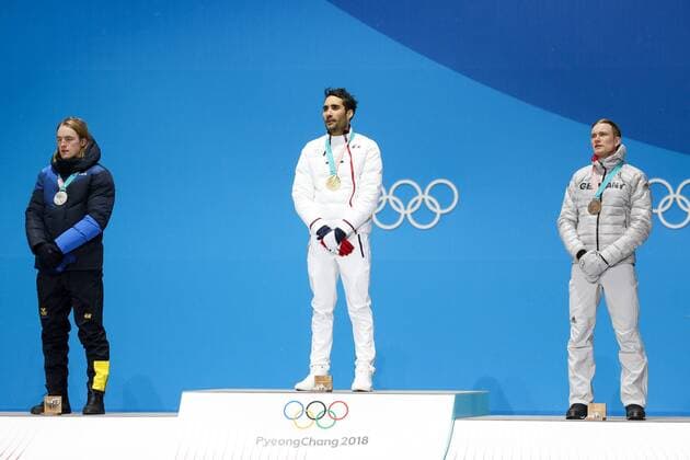 OLYMPICS - 2018 Winter Olympics PYEONGCHANG,SOUTH KOREA.13.FEB.18 - OLYMPICS,BIATHLON - Olympic Winter games Winterspiele Spiele Summer games PyeongChang 2018, Medals Plaza, 12.5km Pursuit, men, award ceremony. Image shows Sebastian Samuelsson (SWE), Martin Fourcade (FRA) and Benedikt Doll (GER). Keywords: medals. GEPAxpictures xMaticxKlansek