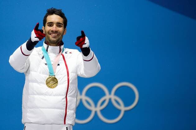 OLYMPICS - 2018 Winter Olympics PYEONGCHANG,SOUTH KOREA.13.FEB.18 - OLYMPICS,BIATHLON - Olympic Winter games Winterspiele Spiele Summer games PyeongChang 2018, Medals Plaza, 12.5km Pursuit, men, award ceremony. Image shows Martin Fourcade (FRA). Keywords: medal. GEPAxpictures xMaticxKlansek