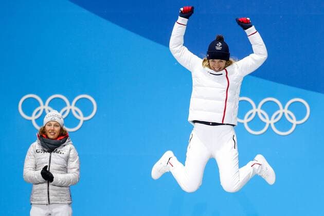 OLYMPICS - 2018 Winter Olympics PYEONGCHANG,SOUTH KOREA.13.FEB.18 - OLYMPICS,BIATHLON - Olympic Winter games Winterspiele Spiele Summer games PyeongChang 2018, Medals Plaza, 10km Pursuit, ladies, award ceremony. Image shows Laura Dahlmeier (GER) and the rejoicing of Anais Bescond (FRA). GEPAxpictures xMaticxKlansek