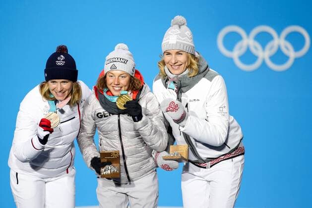 OLYMPICS - 2018 Winter Olympics PYEONGCHANG,SOUTH KOREA.13.FEB.18 - OLYMPICS,BIATHLON - Olympic Winter games Winterspiele Spiele Summer games PyeongChang 2018, Medals Plaza, 10km Pursuit, ladies, award ceremony. Image shows Anastasiya Kuzmina (SVK), Laura Dahlmeier (GER) and Anais Bescond (FRA). Keywords: medals. GEPAxpictures xMaticxKlansek
