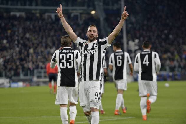 13th February 2018, Allianz Stadium, Turin, Italy; UEFA Champions League football, round of 16, first leg, Juventus versus Tottenham Hotspur; Gonzalo Higuain celebrates after scoring the 1-0 for Juventus from a free kick fake in the 2nd minute of the game  ActionPlus11986646