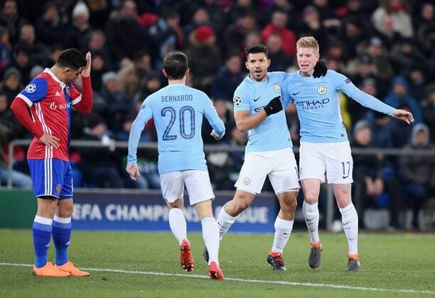 Football CHAMPIONS LEAGUE season 2017 2018 knockout first leg FC Basel Manchester City 13 02 2018 CHEERING Manchester City goalscorer 0 3 Sergio Agueero 2 v re hugged Kevin DeBruyne re and Bernardo Silva 2 v li Blas Riveros li disappointed FC Basel Basel