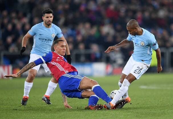 Football CHAMPIONS LEAGUE season 2017 2018 knockout first leg FC Basel Manchester City 13 02 2018 Fernandinho re Manchester City against Leo Lacroix mid FC Basel observed by Sergio Agueero re Manchester City Basel