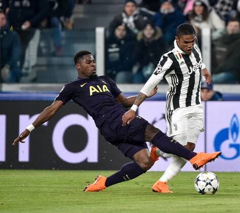 February 13, 2018 - Turin, Italy - Douglas Costa of Juventus is fauled by Serge Aurier of Tottenham and wins a penalty kick during the UEFA Champions League Round of 16 match between Juventus and Tottenham Hotspur at the Juventus Stadium, Turin, Italy on 13 February 2018. Juventus v Tottenham - UEFA Champions League  - ZUMAn230 20180213_zaa_n230_580 Copyright: xGiuseppexMaffiax