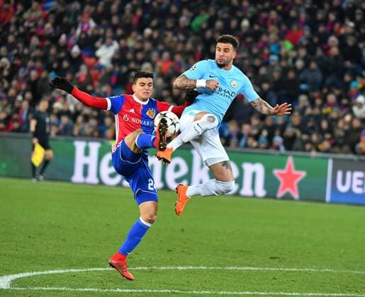 13 02 2018 Basel St James Park football men s season 2017 2018 Champions League FC Basel Manchester City picture shows Nicolas Otamendi Manchester against Mohamed Elyounoussi i FC Basel Action battle