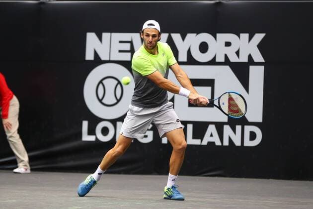 UNIONDALE, NY - FEBRUARY 13: Stefano Travaglia of Italy returns during the New York Open Tennis on February 13, 2018, at NYCB Live in Uniondale, NY. (Photo by Rich Graessle Icon Sportswire) TENNIS: FEB 13 New York Open Icon0213181539 EDITORIAL USE ONLY