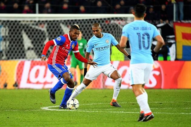 13th February 2018, St Jakob Park, Basel, Switzerland; UEFA Champions League football, round of 16, first leg, FC Basel versus Manchester City; Fernandinho of Manchester City challenges Geoffroy Serey Die of FC Basel for the ball  ActionPlus11986715
