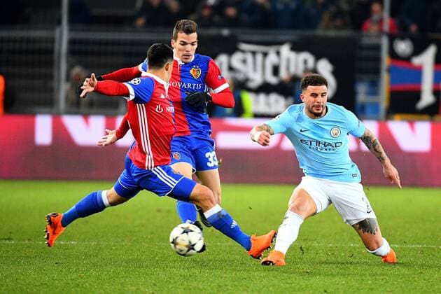 13th February 2018, St Jakob Park, Basel, Switzerland; UEFA Champions League football, round of 16, first leg, FC Basel versus Manchester City; Kyle Walker of Manchester City is challenged for the ball by Kevin Bua of FC Basel and Mohamed Elyounoussi of FC Basel  ActionPlus11986766