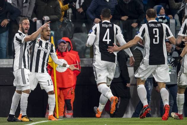 Gonzalo Gerardo Higuain of Juventus celebrates after scoring his team s first goal during the Italian Uefa Champions League Round of 16 First leg match between Juventus 2-2 Tottenham Hotspur at Allianz Stadium on February 13, 2018 in Torino, Germany. Noxthirdxpartyxsales  (72086724)