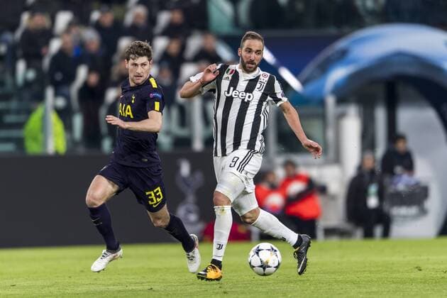 Gonzalo Gerardo Higuain of Juventus and Benjamin Thomas Davies of Tottenham Hotspur F.C. during the Italian Uefa Champions League Round of 16 First leg match between Juventus 2-2 Tottenham Hotspur at Allianz Stadium on February 13, 2018 in Torino, Germany. Noxthirdxpartyxsales  (72086903)