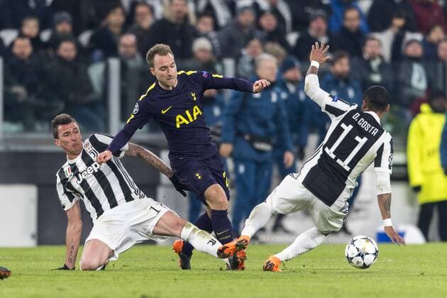 Mario Mandzukic of Juventus and Christian Dannemann Eriksen of Tottenham Hotspur F.C. and Douglas Costa de Souza of Juventus during the Italian Uefa Champions League Round of 16 First leg match between Juventus 2-2 Tottenham Hotspur at Allianz Stadium on February 13, 2018 in Torino, Germany. Noxthirdxpartyxsales  (72087008)