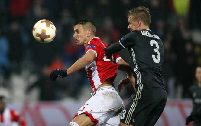 (180214) -- BELGRADE, Feb. 14, 2018 -- Crvena Zvezda s Aleksandar Pesic (L) vies with CSKA Moscow s Pontus Wernbloom during the UEFA Europa League round of 32 first leg football match between Crvena Zvezda and CSKA Moscow in Belgrade, Serbia on Feb. 13, 2018. The match ended with 0-0.) (SP)SERBIA-BELGRADE- EUROPA-FOOTBALL-CRVENA ZVEZDA VS CSKA PredragxMilosavljevic 