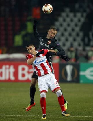 (180214) -- BELGRADE, Feb. 14, 2018 -- Crvena Zvezda s Aleksandar Pesic (L) vies with CSKA Moscow s Pontus Wernbloom during the UEFA Europa League round of 32 first leg football match between Crvena Zvezda and CSKA Moscow in Belgrade, Serbia on Feb. 13, 2018. The match ended with 0-0.) (SP)SERBIA-BELGRADE- EUROPA-FOOTBALL-CRVENA ZVEZDA VS CSKA PredragxMilosavljevic 