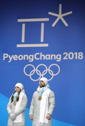 PYEONGCHANG, SOUTH KOREA - FEBRUARY 14, 2018: Bronze medalists, Olympic Athletes from Russia Anastasia Bryzgalova (L) and Aleksandr Krushelnitckii during a medal ceremony for the curling mixed doubles competition at the 2018 Winter Olympic Games Olympische Spiele Olympia OS at Medals Plaza. Sergei Bobylev TASS  TS073BF2