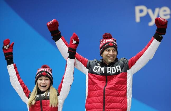 PYEONGCHANG, SOUTH KOREA - FEBRUARY 14, 2018: Gold medalists, Canada s Kaitlyn Lawes (L) and John Morris during a medal ceremony for the curling mixed doubles competition at the 2018 Winter Olympic Games Olympische Spiele Olympia OS at Medals Plaza. Sergei Bobylev TASS  TS073BFE