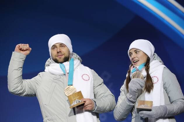 PYEONGCHANG, SOUTH KOREA - FEBRUARY 14, 2018: Bronze medalists, Olympic Athletes from Russia Anastasia Bryzgalova (R) and Aleksandr Krushelnitckii during a medal ceremony for the curling mixed doubles competition at the 2018 Winter Olympic Games Olympische Spiele Olympia OS at Medals Plaza. Sergei Bobylev TASS  TS073C07