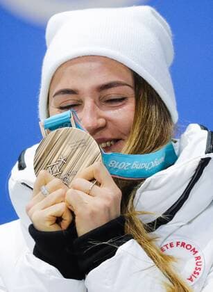 PYEONGCHANG, SOUTH KOREA - FEBRUARY 14, 2018: Bronze medalist, Olympic Athlete from Russia Yulia Belorukova at a medal ceremony for the ladies cross-country skiing individual sprint classic event at the 2018 Winter Olympic Games Olympische Spiele Olympia OS at Medals Plaza. Sergei Bobylev TASS  TS073C2E