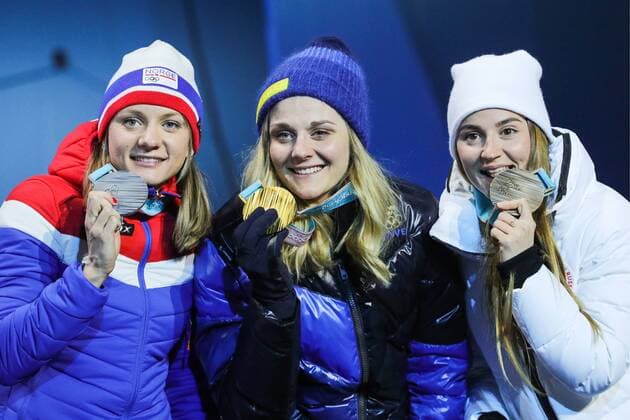 PYEONGCHANG, SOUTH KOREA - FEBRUARY 14, 2018: Silver medalist, Norway s Maiken Caspersen Falla, Gold medalist, Sweden s Stina Nilsson and Bronze medalist, Olympic Athlete from Russia Yulia Belorukova (L-R) at a medal ceremony for the ladies cross-country skiing individual sprint classic event at the 2018 Winter Olympic Games Olympische Spiele Olympia OS at Medals Plaza. Sergei Bobylev TASS  TS073C34