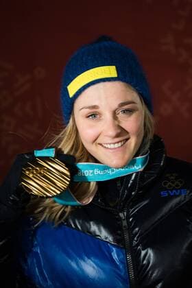 180214 Stina Nilsson of Sweden Gold celebrating at the medal ceremony for the Women s Cross Country Sprint during day five of the 2018 Winter Olympics on February 14 2018 in Pyeongchang Photo Carl Sandin BILDBYRAN code CS 57999 292  Copyright: CARLxSANDIN BB180214CS118
