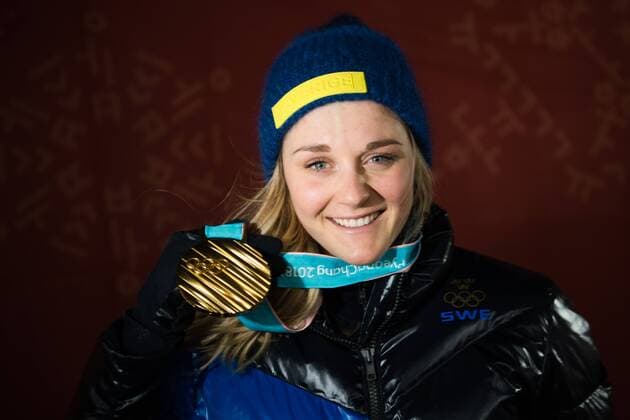 180214 Stina Nilsson of Sweden Gold celebrating at the medal ceremony for the Women s Cross Country Sprint during day five of the 2018 Winter Olympics on February 14 2018 in Pyeongchang Photo Carl Sandin BILDBYRAN code CS 57999 292  Copyright: CARLxSANDIN BB180214CS120