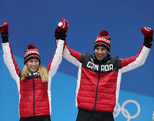 (180214) -- PYEONGCHANG, Feb. 14, 2018 -- Champion Kaitlyn Lawes (L) and John Morris of Canada celebrate during medal ceremony of the mixed doubles event of curling at 2018 PyeongChang Winter Olympic Games Olympische Spiele Olympia OS at the Medal Plaza in PyeongChang, South Korea, on Feb. 14, 2018. ) (SP)OLY-SOUTH KOREA-PYEONGCHANG-CURLING-MIXED DOULBES-MEDAL CEREMONY WuxZhuang 