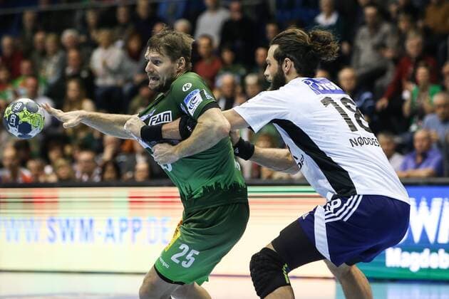 Marko Bezjak SC Magdeburg against Jesper Nöddesbo Bjerringbro Silkeborg handball EHF Cup group stages season 2017 2018 SC Magdeburg vs Bjerringbro Silkeborg in the GETEC arena in Magdeburg Germany handball men men 14 02 2018