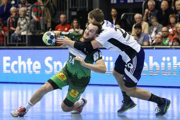 Christian O Sullivan SC Magdeburg against Rasmus Theimer Jensen Bjerringbro Silkeborg handball EHF Cup group stages season 2017 2018 SC Magdeburg vs Bjerringbro Silkeborg in the GETEC arena in Magdeburg Germany handball men men 14 02 2018