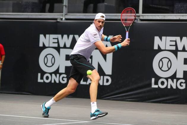 UNIONDALE, NY - FEBRUARY 14: John Isner of the United States during his New York Open Match on February 14, 2018, at NYCB Live in Uniondale, NY. (Photo by Rich Graessle Icon Sportswire) TENNIS: FEB 14 New York Open Icon0214181675 EDITORIAL USE ONLY