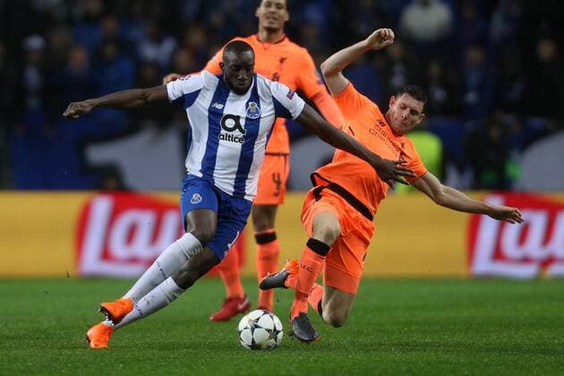 February 14, 2018 - Porto, Porto, Portugal - Porto s Malian forward Moussa Marega (L) vies with James Milner midfielder of Liverpool (R) during the UEFA Champions League, match between FC Porto and Liverpool, at Dragao Stadium in Porto on February 14, 2018 in Porto, Portugal. FC Porto v Liverpool - UEFA Champions League Round of 16: First Leg  - ZUMAn230 20180214_zaa_n230_659 Copyright: xDpix