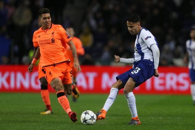 February 14, 2018 - Porto, Porto, Portugal - Porto s Mexican defender Diego Reyes (R) in action with Roberto Firmino forward of Liverpool (L) during the UEFA Champions League, match between FC Porto and Liverpool, at Dragao Stadium in Porto on February 14, 2018 in Porto, Portugal. FC Porto v Liverpool - UEFA Champions League Round of 16: First Leg  - ZUMAn230 20180214_zaa_n230_674 Copyright: xDpix