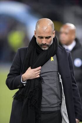 13 02 2018 football UEFA Champions League 2017 2018 knockout FC Basel Manchester City at St James Park Stadium in Basel Switzerland coach PEP Guardiola Manchester City shows when walking to the Bank sports press TV and photographers gathered his political convictions before the by he extra low profile his pulls the yellow loop to make the yellow ribbon on his chest are visible a symbol for solidarity and support with the jailed politicians and activists of the independence movement in Catalonia is sound to the page in Catalonia is its importance hochpolitisch the loop is carried by many Catalans