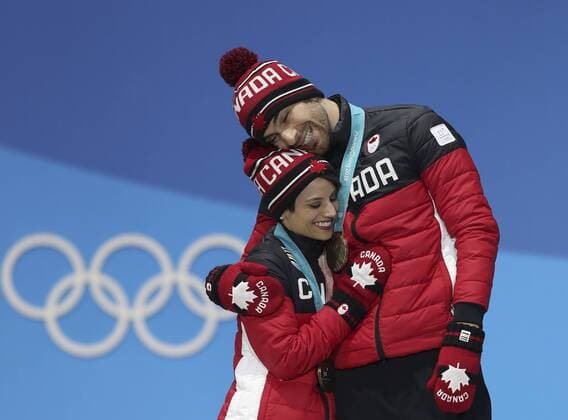 (180215) -- PYEONGCHANG, Feb. 15, 2018 -- Bronze medalists Meagan Duhamel (L) and Eric Radford of Canada pose for photos during medal ceremony of pair skating of Figure skating Eiskunstlauf at PyeongChang 2018 Winter Olympic Games Olympische Spiele Olympia OS at Medal Plaza, PyeongChang, South Korea, Feb. 15, 2018. ) (SP)OLY-SOUTH KOREA-PYEONGCHANG-FIGURE SKATING-PAIR SKATING-MEDAL CEREMONY WuxZhuang 