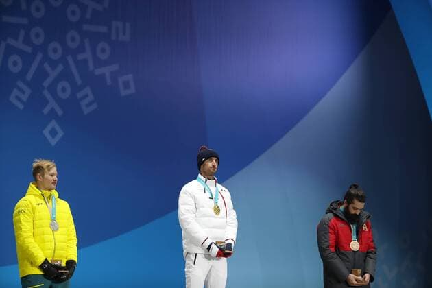 OLYMPICS - 2018 Winter Olympics PYEONGCHANG,SOUTH KOREA,15.FEB.18 - OLYMPICS, SNOWBOARDING - Olympic Winter games Winterspiele Spiele Summer games PyeongChang 2018, Medals Plaza, snowboard cross, men, award ceremony. Image shows Jarryd Hughes (AUS), Pierre Vaultier (FRA) and Regino Hernandez (ESP). Keywords: medal. GEPAxpictures xAndreasxPranter