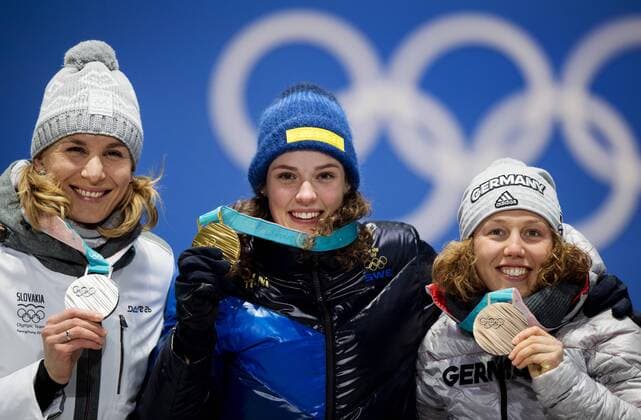 180216 Anastasiya KUZMINA of Slovakia silver Hanna Oberg of Sweden gold Laura DAHLMEIER of Germany bronze celebrate at a Medal Ceremony for women s 15 km biathlon during day seven of the 2018 Winter Olympics on February 16 2018 in Pyeongchang Photo Jon Olav Nesvold BILDBYRAN kod JE 160172  Copyright: JONxOLAVxNESVOLD BB180216JE072