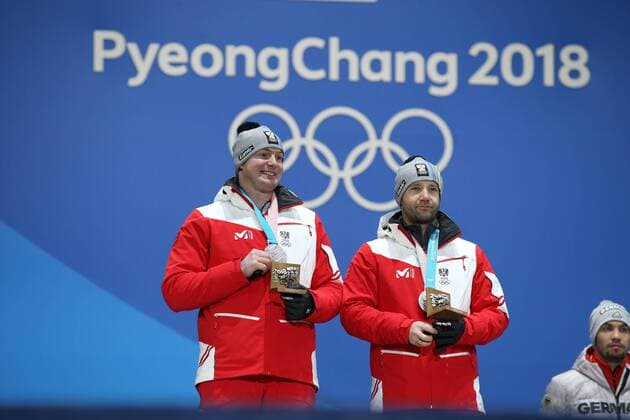 OLYMPICS - 2018 Winter Olympics PYEONGCHANG,SOUTH KOREA,16.FEB.18 - OLYMPICS, LUGE - Olympic Winter games Winterspiele Spiele Summer games PyeongChang 2018, Medals Plaza, doubles, men, award ceremony. Image shows Peter Penz and Georg Fischler (AUT). GEPAxpictures xMathiasxMandl