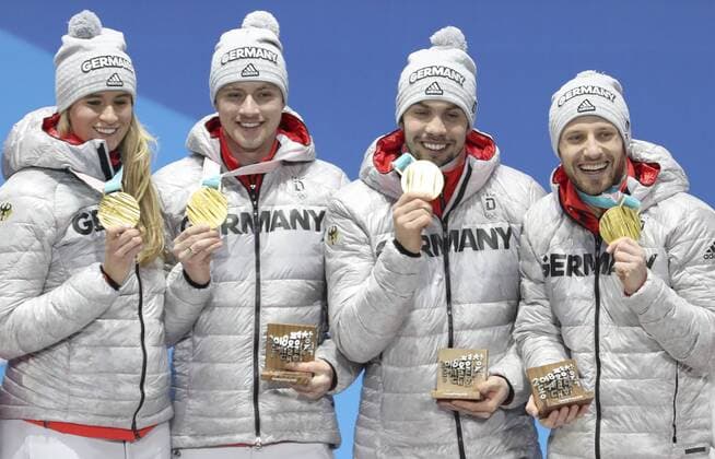 (180216) -- PYEONGCHANG, Feb. 16, 2018 -- Members of champion team Germany pose for photos during medal ceremony of team relay competition of luge at 2018 PyeongChang Winter Olympic Games Olympische Spiele Olympia OS at Medal Plaza, PyeongChang, South Korea, Feb. 16. 2018. ) (SP)OLY-SOUTH KOREA-PYEONGCHANG-LUGE-TEAM RELAY-MEDAL CEREMONY BaixXuefei 