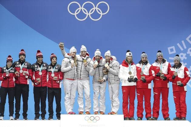 (180216) -- PYEONGCHANG, Feb. 16, 2018 -- Members of champion team Germany (C), second-placed Canada (L) and third-placed Austria pose for photos during medal ceremony of team relay competition of luge at 2018 PyeongChang Winter Olympic Games Olympische Spiele Olympia OS at Medal Plaza, PyeongChang, South Korea, Feb. 16. 2018. ) (SP)OLY-SOUTH KOREA-PYEONGCHANG-LUGE-TEAM RELAY-MEDAL CEREMONY BaixXuefei 