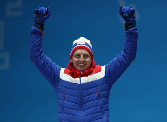 PYEONGCHANG, SOUTH KOREA â€“ FEBRUARY 16, 2018: Silver medallist Simen Hegstad Krueger of Norway poses at a victory ceremony for the men s 15km freestyle cross-country skiing race at the 2018 Winter Olympic Games Olympische Spiele Olympia OS Valery Sharifulin TASS  TS07431D