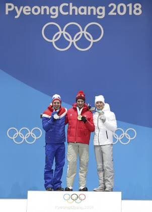 (180216) -- PYEONGCHANG, Feb. 16, 2018 -- Champion Dario Cologna (C) of Switzerland, second-placed Simen Hegstad Krueger (L) of Norway and third-placed Olympic athlete from Russia Denis Spitsov pose for photos during medal ceremony of men s 15km free event of cross country skiing at 2018 PyeongChang Winter Olympic Games Olympische Spiele Olympia OS at Medal Plaza, PyeongChang, South Korea, Feb. 16, 2018. ) (SP)OLY-SOUTH KOREA-PYEONGCHANG-CROSS COUNTRY SKIING-MEN S 15KM FREE-MEDAL CEREMONY BaixXuefei 