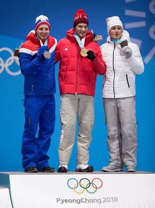 180216 Simen Hegstad Küger of Norway silver Dario Cologna of Switzerland gold and Denis SPITSOV of OAR bronze celebrate at a Medal Ceremony for men cross-country 15 km during day seven of the 2018 Winter Olympics on February 16 2018 in Pyeongchang Photo Jon Olav Nesvold BILDBYRAN kod JE 160172  Copyright: JONxOLAVxNESVOLD BB180216JE081