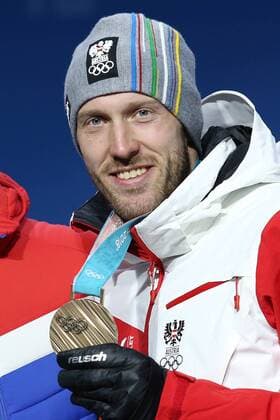 OLYMPICS - 2018 Winter Olympics PYEONGCHANG,SOUTH KOREA,16.FEB.18 - OLYMPICS,BIATHLON - Olympic Winter games Winterspiele Spiele Summer games PyeongChang 2018, Medals Plaza, 20km biathlon, men, award ceremony. Image shows Dominik Landertinger (AUT). GEPAxpictures xMathiasxMandl