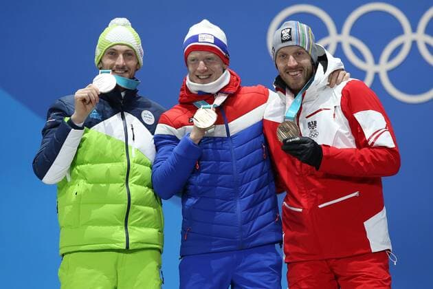 OLYMPICS - 2018 Winter Olympics PYEONGCHANG,SOUTH KOREA,16.FEB.18 - OLYMPICS,BIATHLON - Olympic Winter games Winterspiele Spiele Summer games PyeongChang 2018, Medals Plaza, 20km biathlon, men, award ceremony. Image shows Jakov Fak (SLO), Johannes Thingnes Boe (NOR) and Dominik Landertinger (AUT). GEPAxpictures xMathiasxMandl
