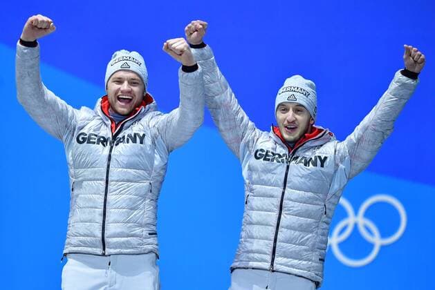 Bronze medalist Germany s Toni Eggert and Sascha Benecken celebrate during the medal ceremony for Luge Doubles at the Pyeongchang 2018 Winter Olympics in Pyeongchang, South Korea, on February 16, 2018.  OLY20180216370 KEVINxDIETSCH