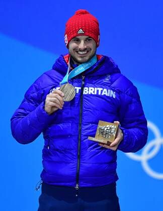 Bronze medalist Greaet Britain s Dom Parsons celebrate during the medal ceremony for Men s Skeleton at the Pyeongchang 2018 Winter Olympics in Pyeongchang, South Korea, on February 16, 2018.  OLY20180216377 KEVINxDIETSCH